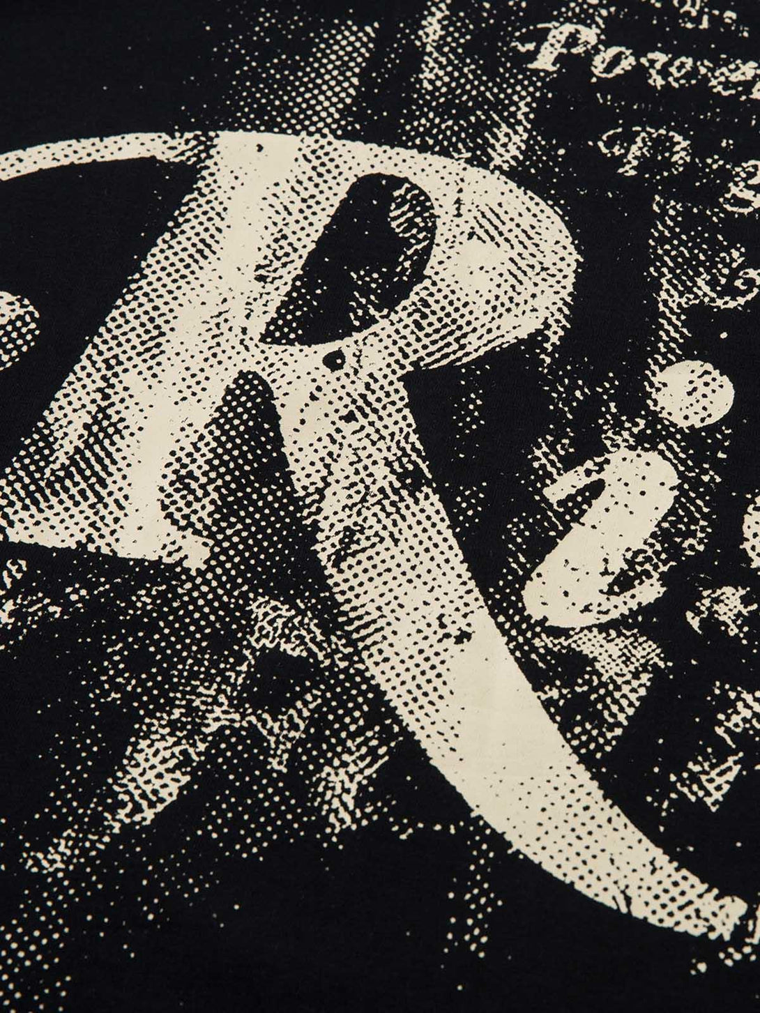 Intricate look at the Phantom Letter Print T-shirt by TALISHKO, showcasing bold design details.