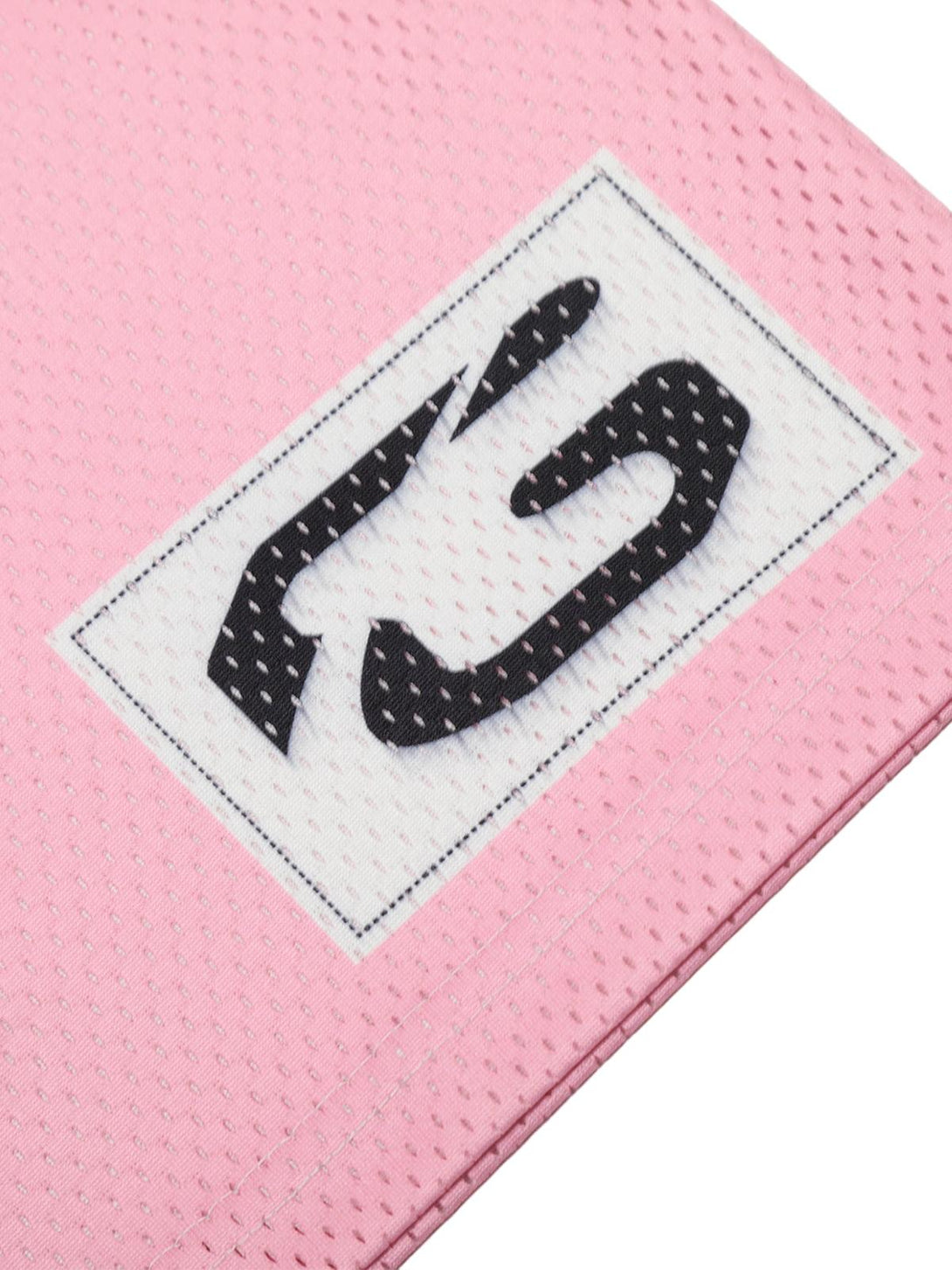 "Intricate design detail on TALISHKO's pink flame print jersey T-shirt fabric corner."