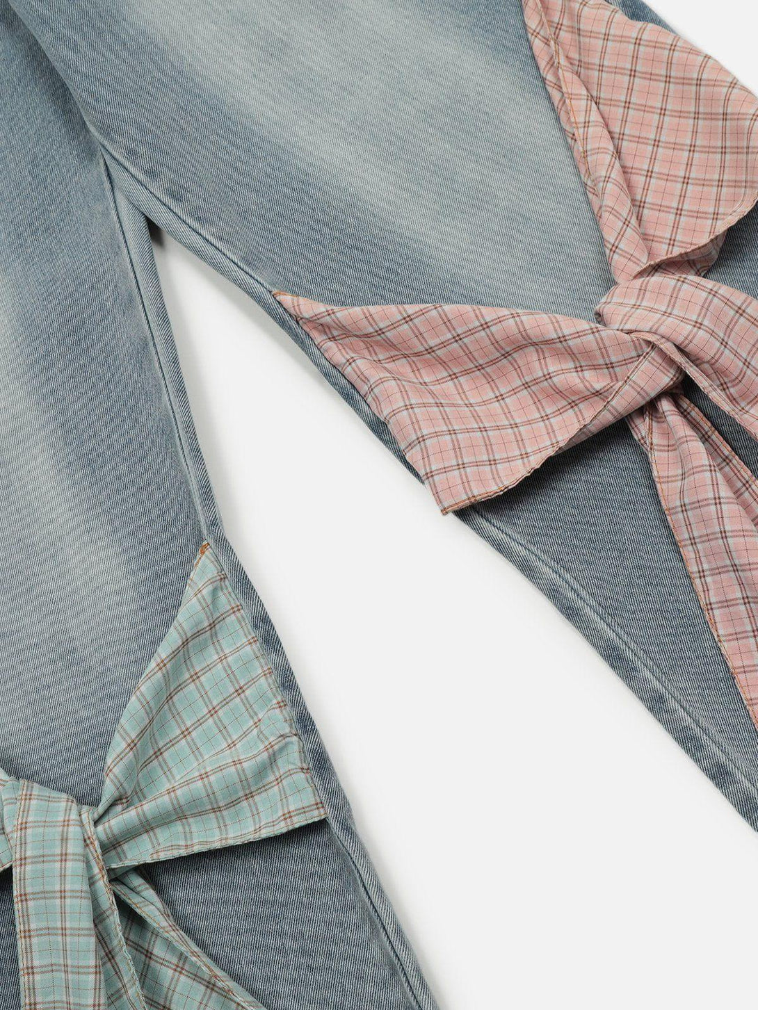 Plaid bow details on TALISHKO loose jeans, highlighting unique design and texture.