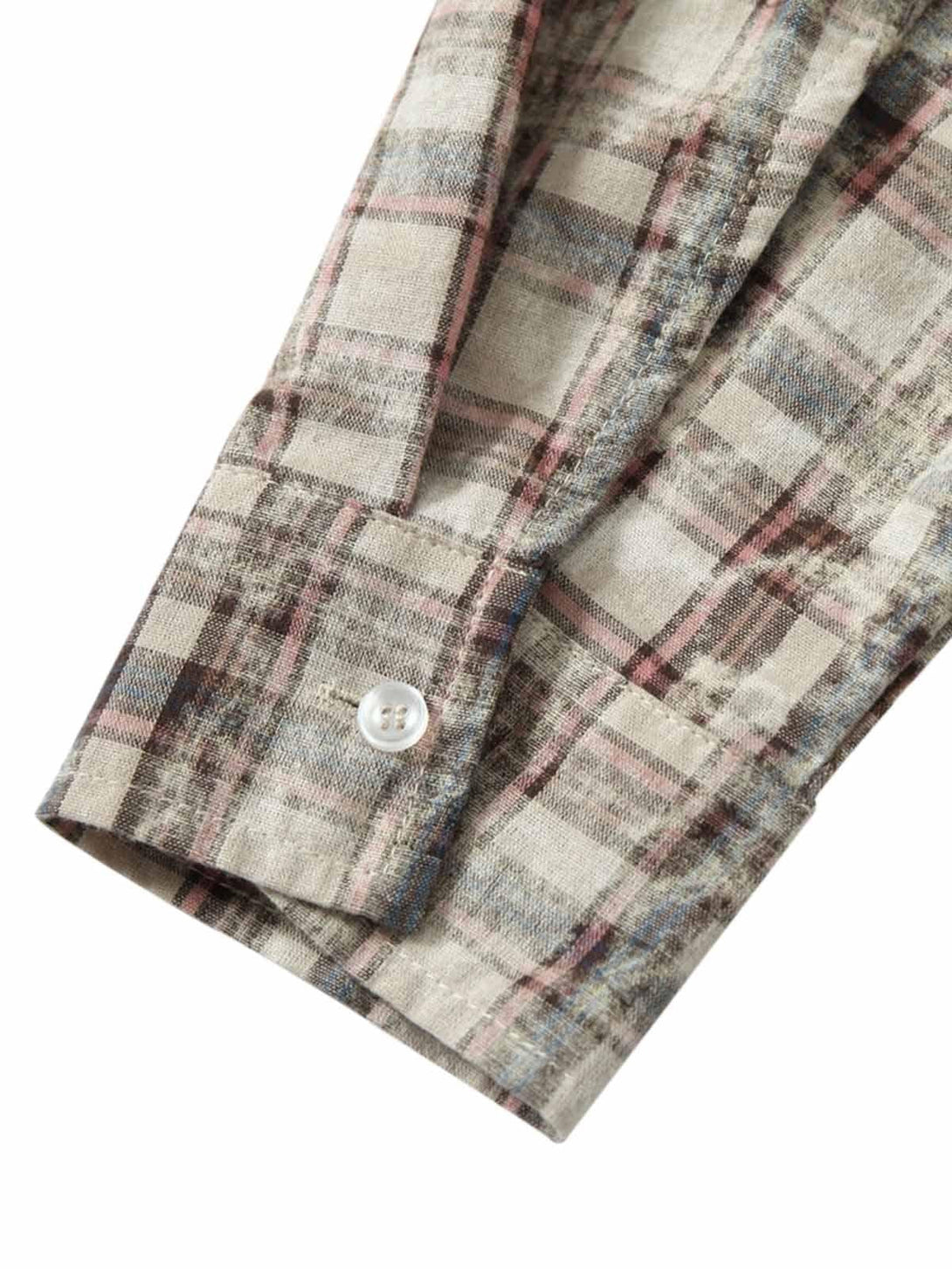 Focusing on the sleeve detail of TALISHKO's plaid shirt, showcasing unique button and pattern.