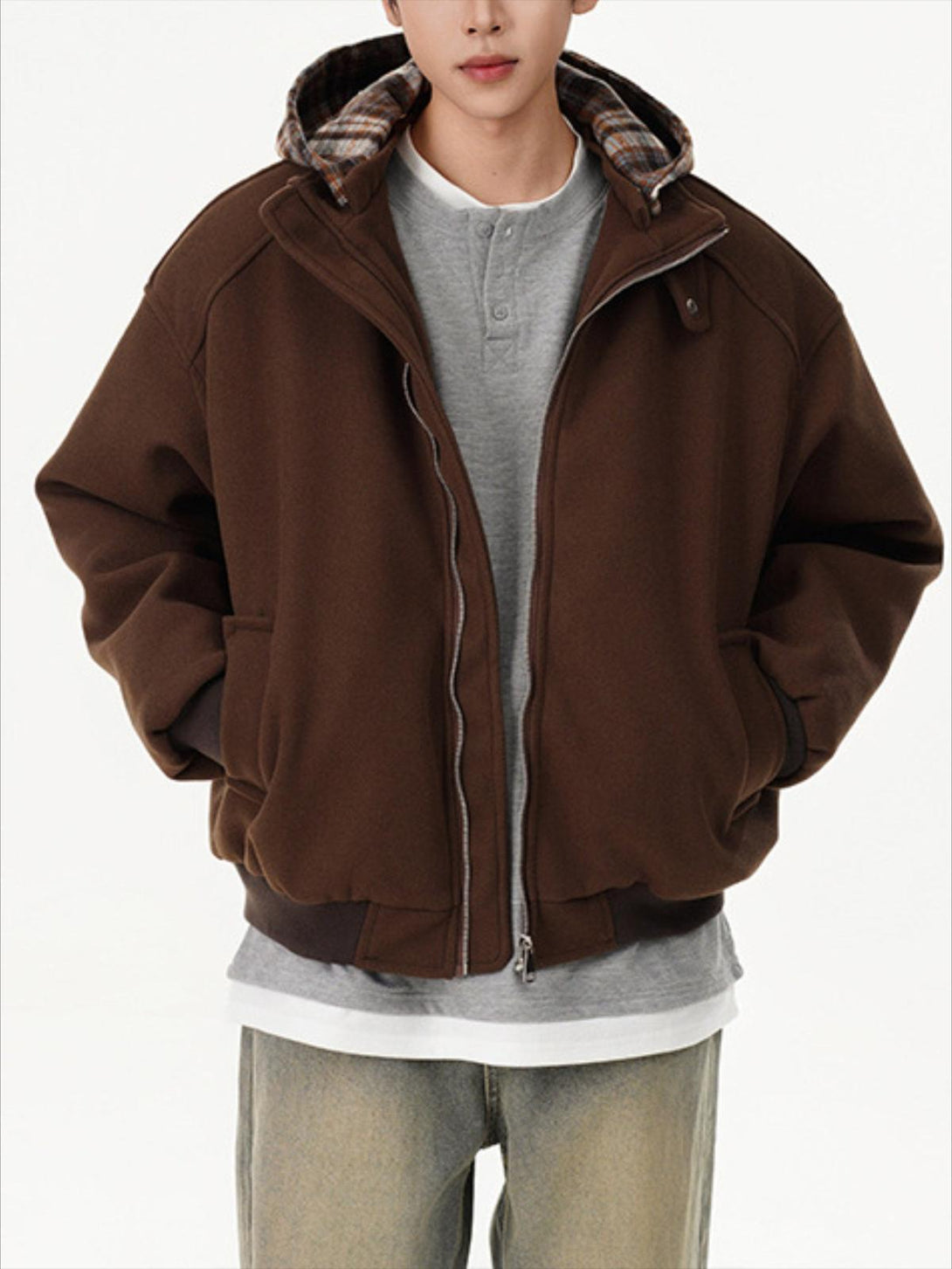 Plaid panel hoodie by TALISHKO in brown, modeled for a casual layered look.