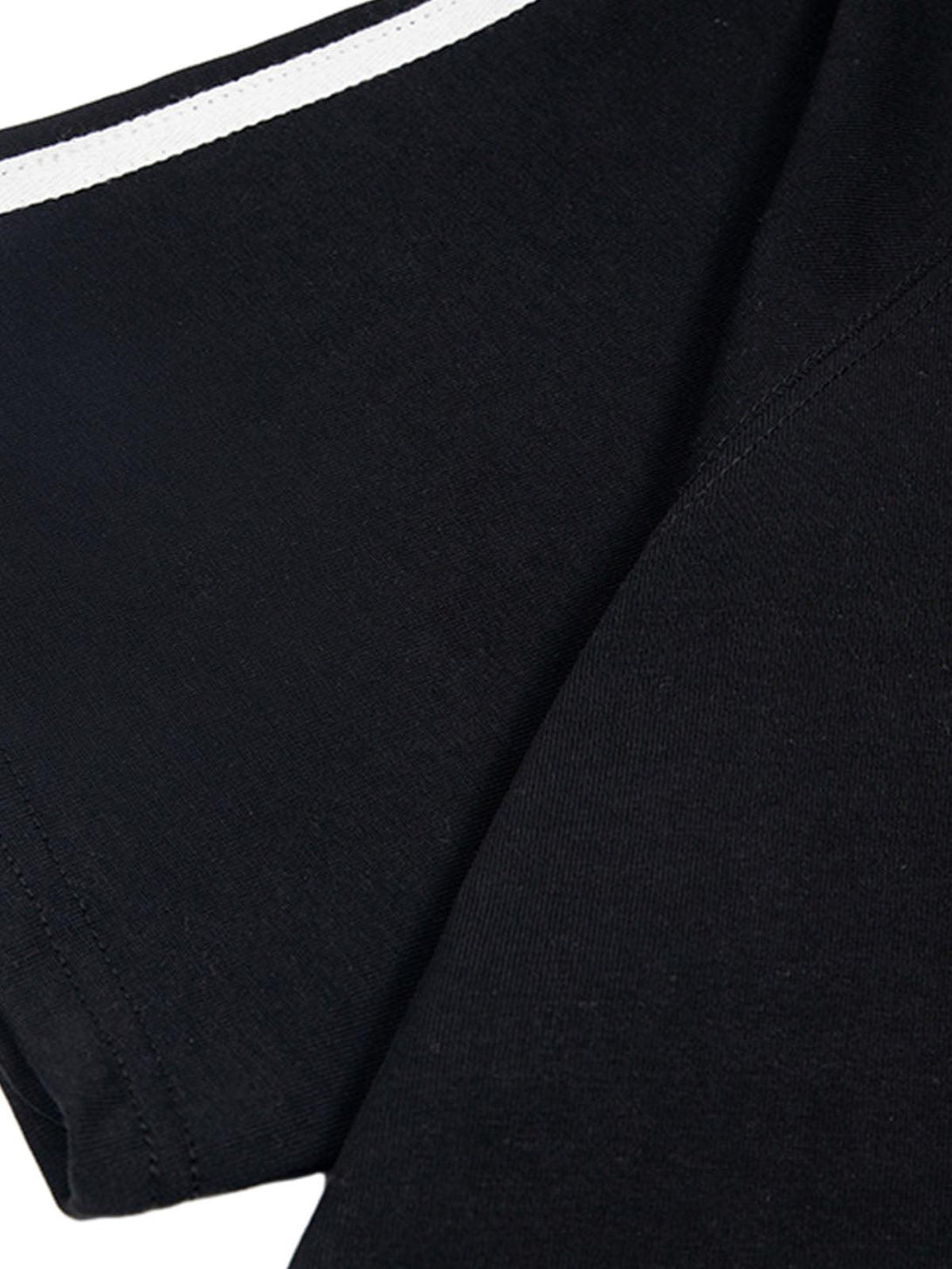 A close-up of the black T-shirt fabric by TALISHKO, highlighting the fine texture and stitching.