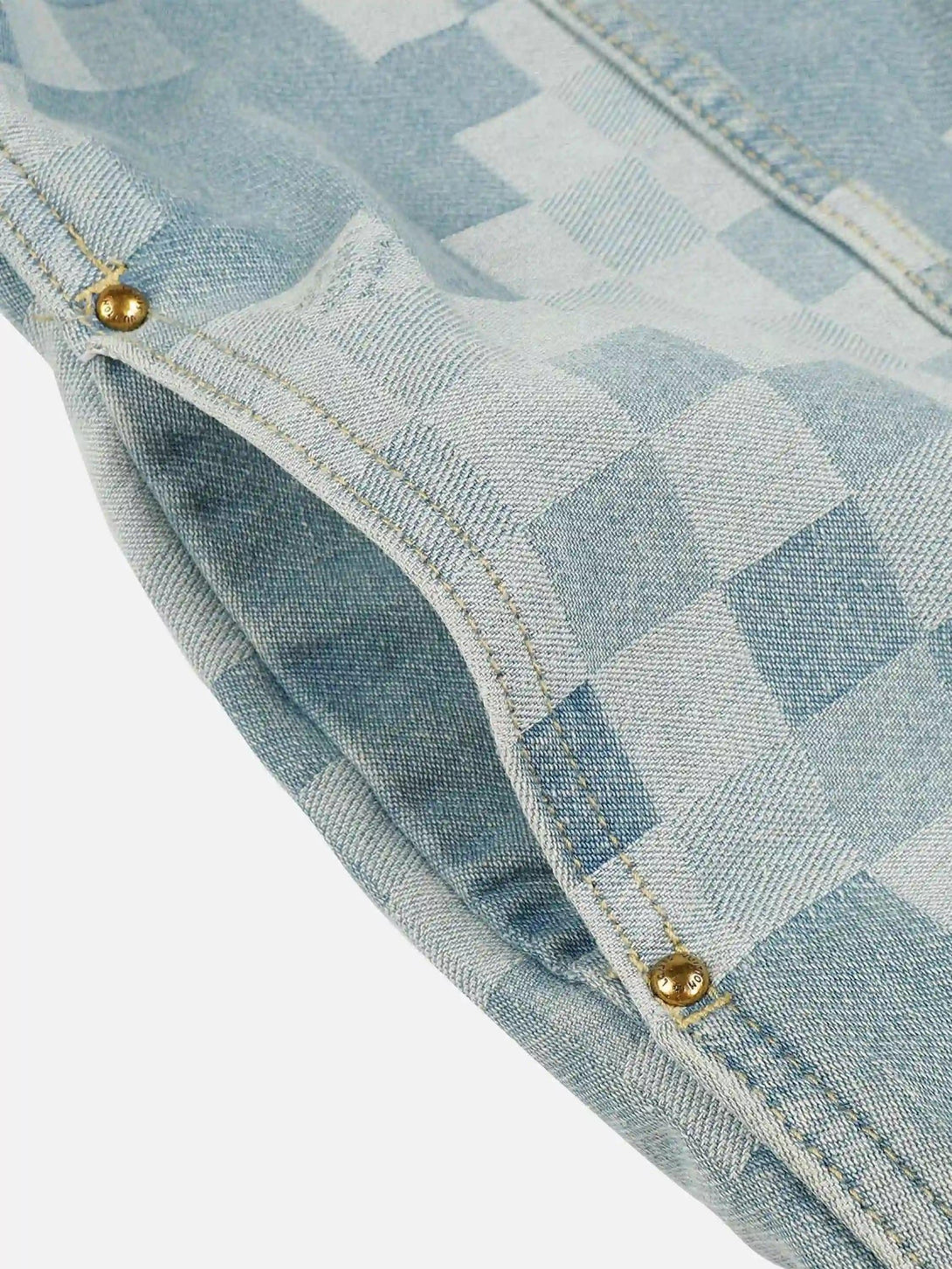 Texture and pattern showcased with TALISHKO's plaid denim jacket and pearl button detail.