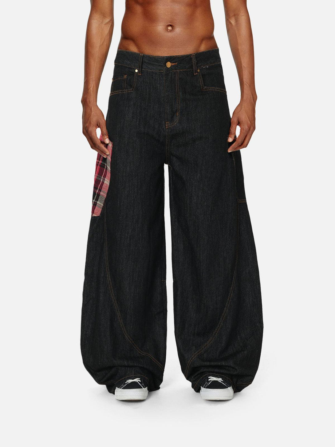 Model showcasing TALISHKO barrel loose jeans with a plaid pocket, styled with sneakers.
