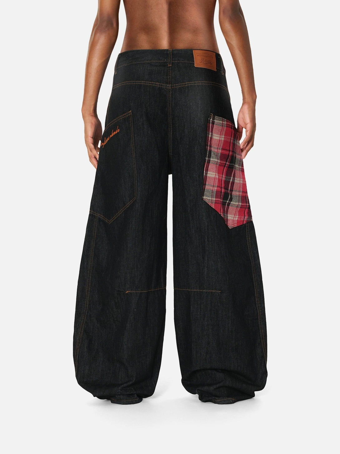 Back view of TALISHKO barrel loose jeans with plaid pocket detail, perfect for unique style.