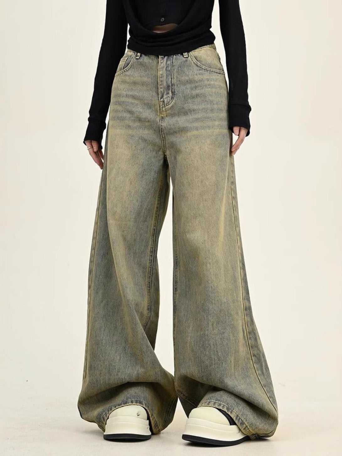 TALISHKO's washed wide-leg jeans worn with a black top, showcasing a relaxed, stylish fit.