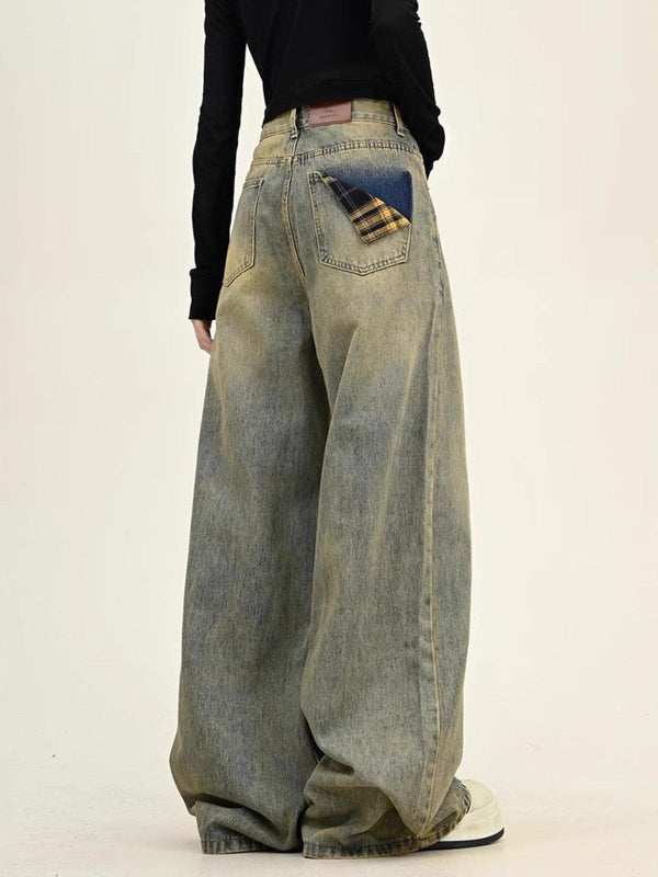 TALISHKO wide-leg jeans featuring a unique plaid pocket detail, styled with a casual black top.