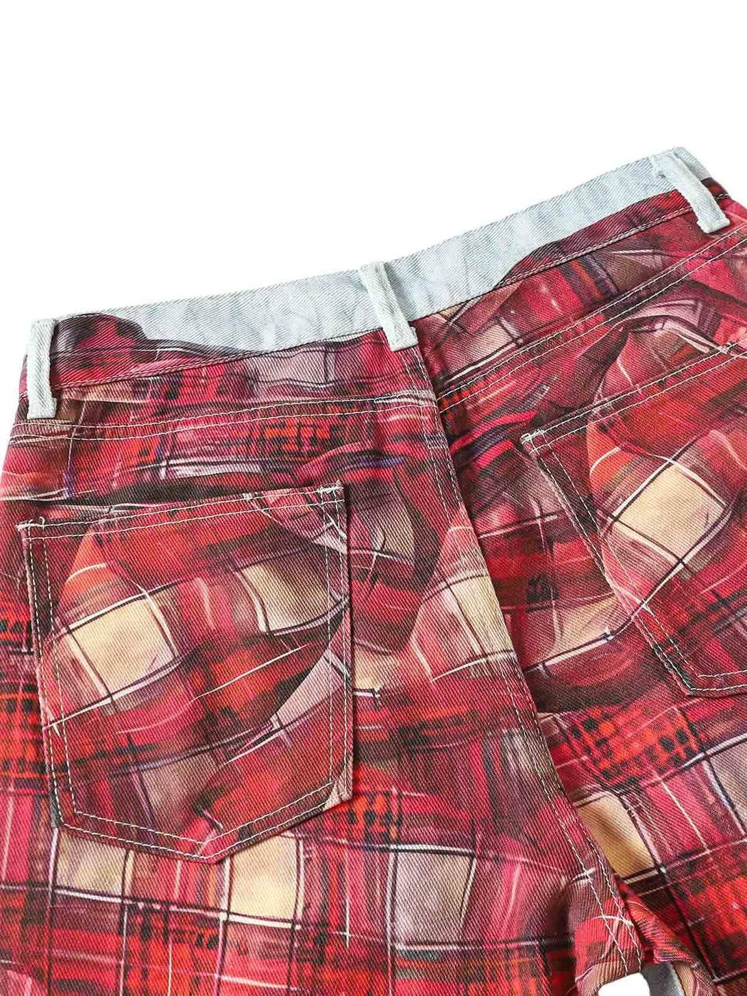 Back view of TALISHKO's plaid print baggy jeans, showcasing vibrant red tones and design.