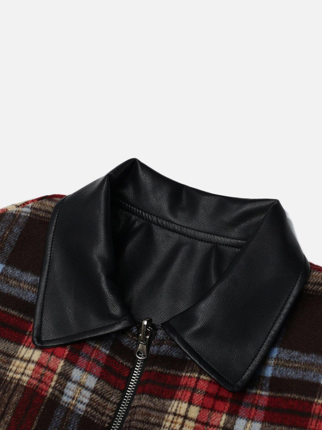 Zoomed-in view of TALISHKO's plaid reversible leather jacket collar, highlighting sleek details.