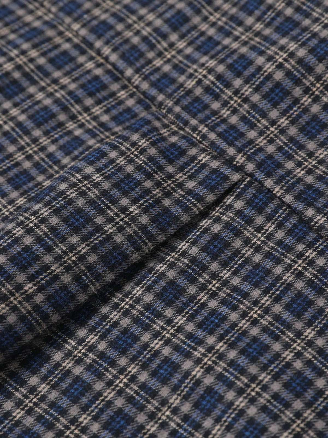 A detailed view of the plaid texture on TALISHKO's short sleeve polo shirt.