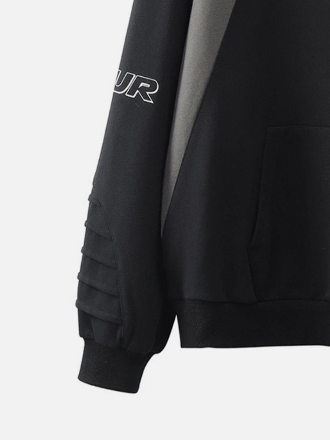 Intricate look at TALISHKO hoodie sleeve with pleated details and material splicing design.