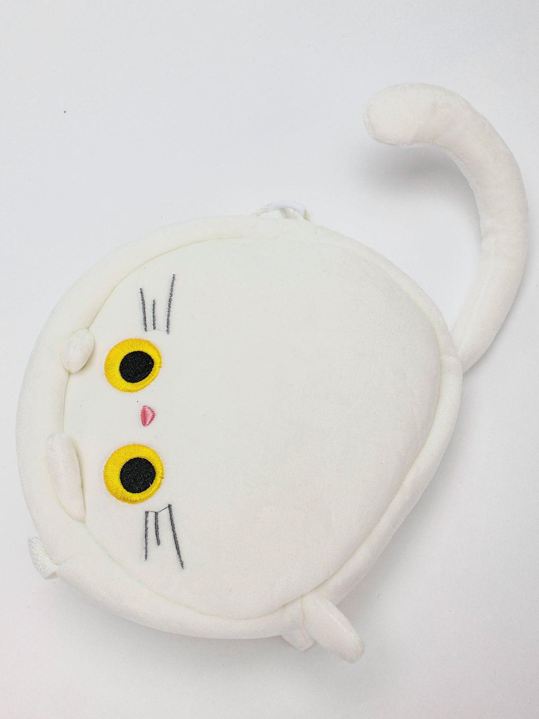 Round plush cat crossbody bag by TALISHKO, featuring a whimsical design with yellow eyes.