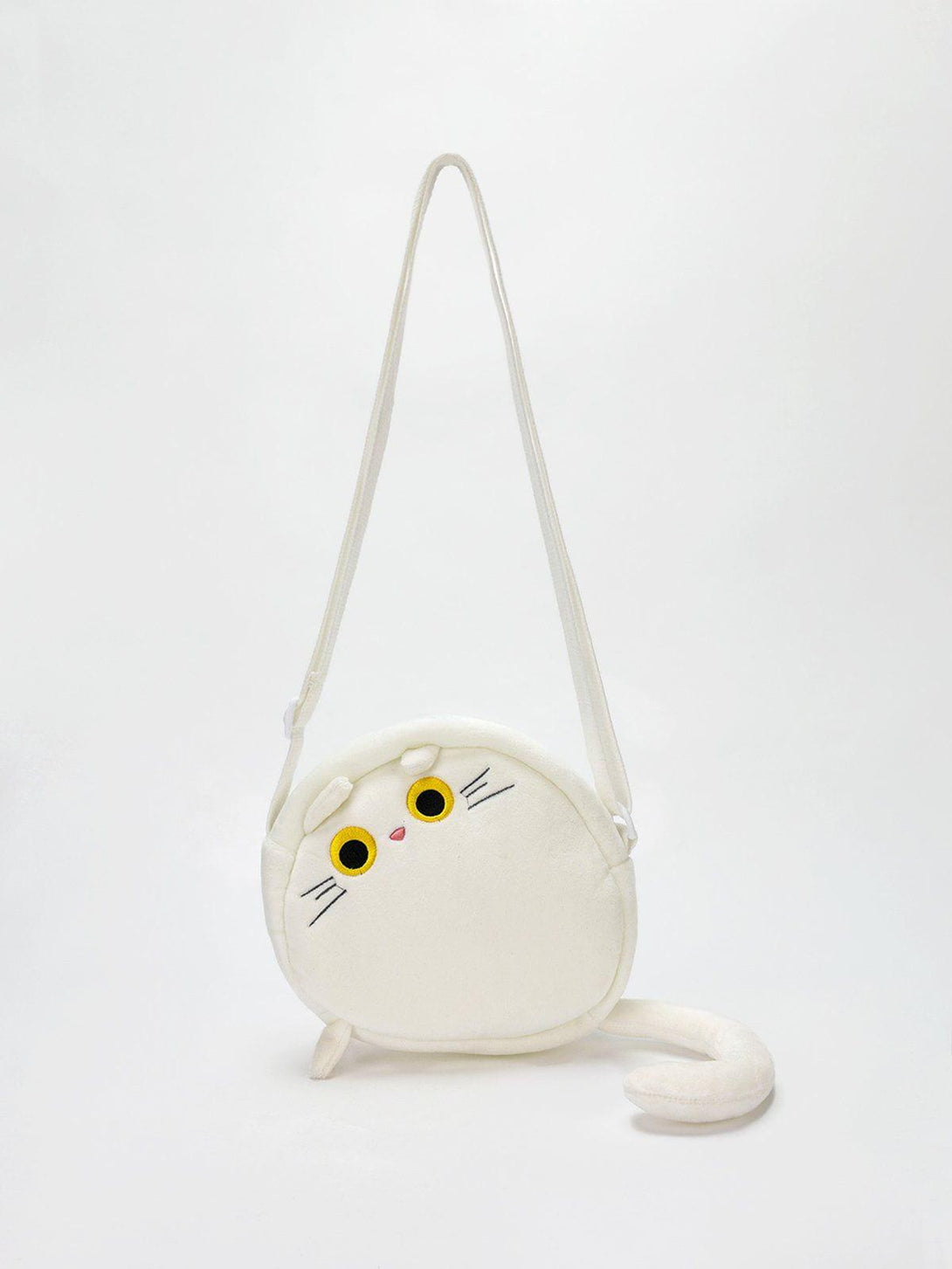 Cute plush cat crossbody bag by TALISHKO, featuring playful design with yellow eyes and a tail.