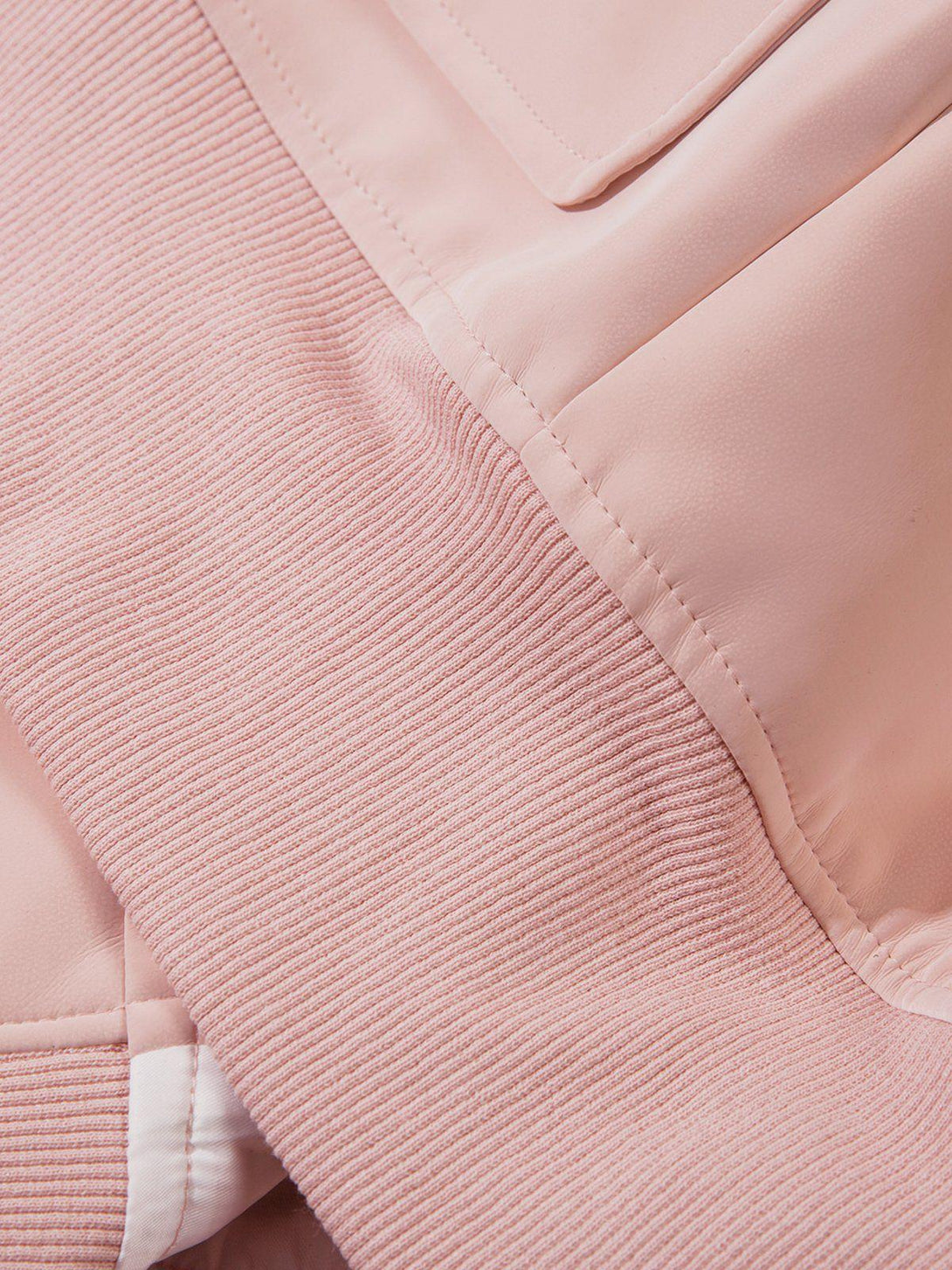 Intricate look at plush collar and textured suede faux leather by TALISHKO in pink.