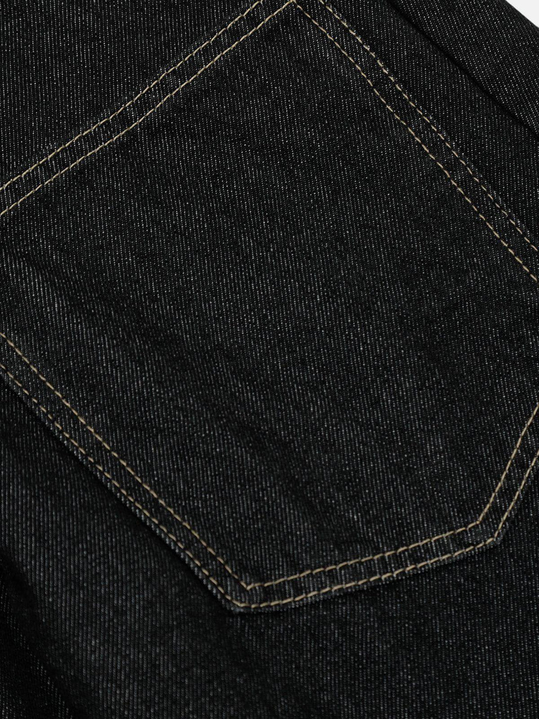 Detailed stitching on TALISHKO plush patchwork jeans pocket, showcasing craftsmanship and style.