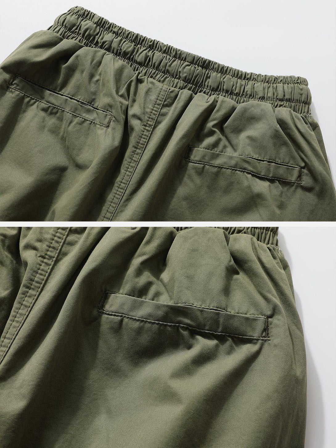 A detailed look at the back of olive pants by TALISHKO, highlighting flap pockets and elastic waist.