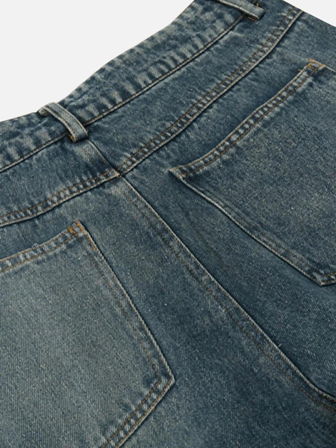 Detailed view of TALISHKO jeans' back pockets, showcasing classic washed denim style.