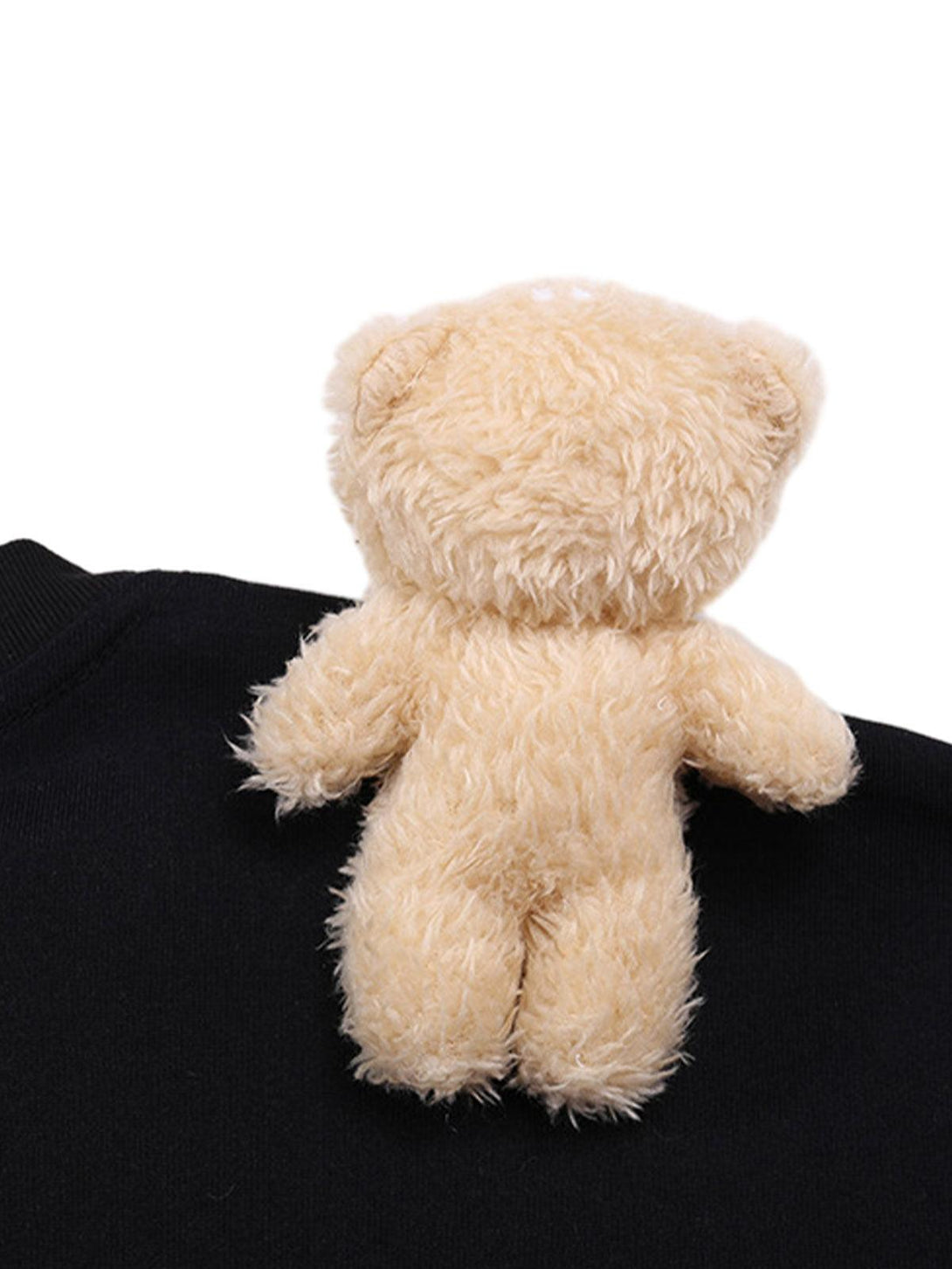TALISHKO's cute bear plush detail on a black t-shirt adds a whimsical touch to your outfit.