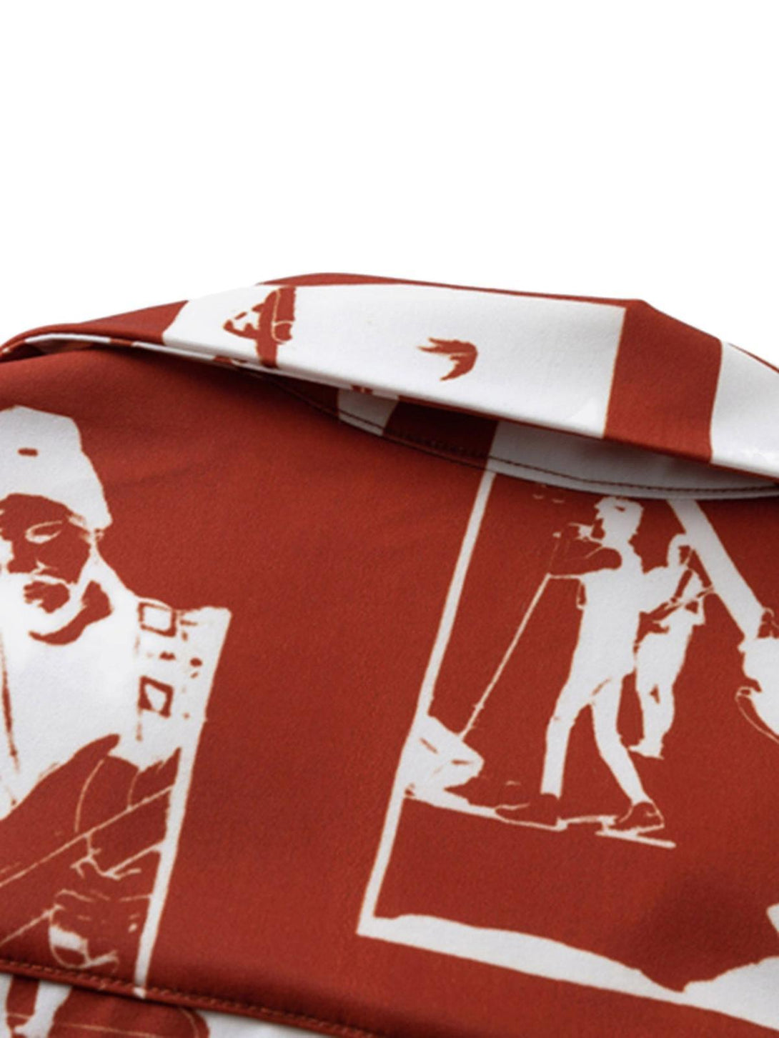 A close-up of the TALISHKO shirt's red portrait pattern, highlighting its artistic design.