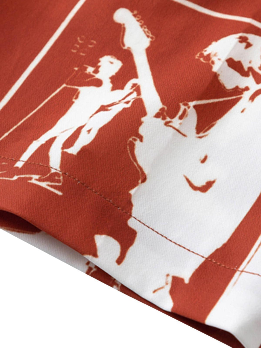 "Zoomed-in view of the TALISHKO shirt's red portrait pattern, emphasizing artistic details."