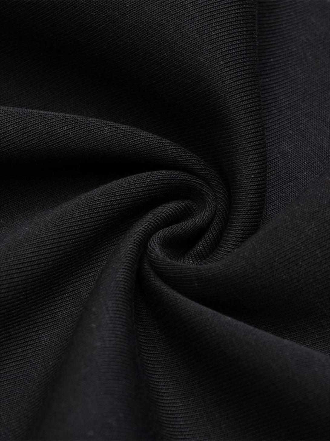 A detailed view of the soft black fabric on a TALISHKO portrait print hoodie.