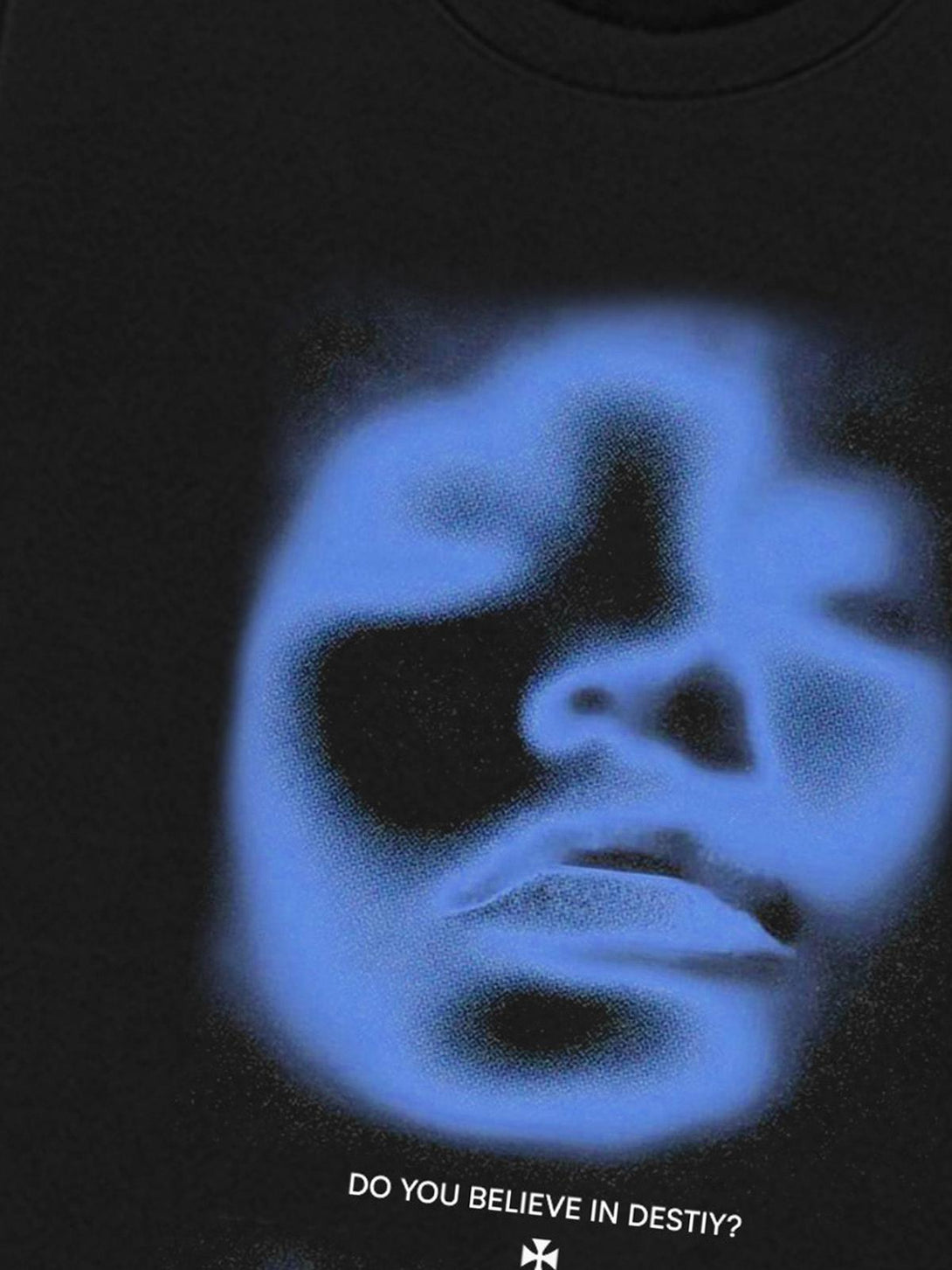A close-up of a black TALISHKO sweatshirt highlighting a blue portrait print and text detail.