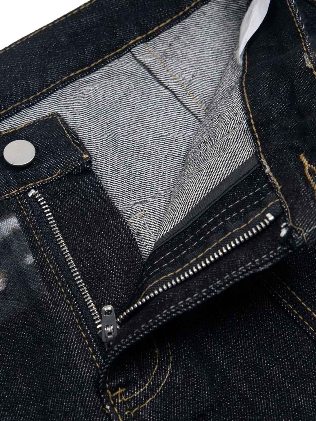 Detailed view of TALISHKO baggy jeans' inner stitching and zipper, highlighting craftsmanship.