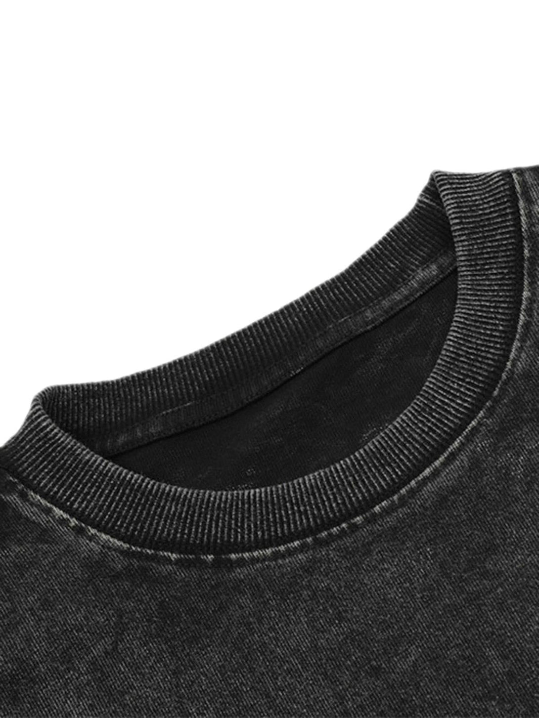 Focusing on the ribbed neckline of a black T-shirt by TALISHKO, highlighting its punk-inspired texture.