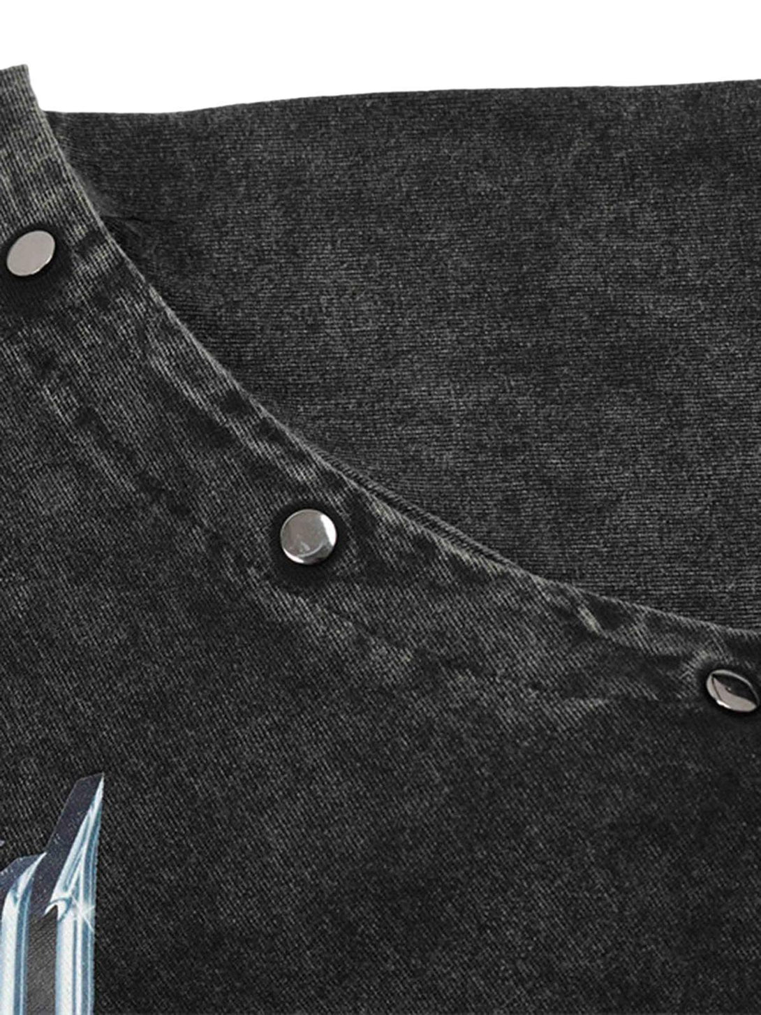 Detailed view of a black T-shirt by TALISHKO, showcasing metal button accents and textured fabric.