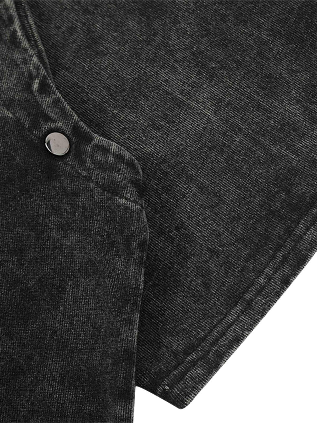 Detailed fabric and stitching of a black TALISHKO T-shirt, showcasing its punk-inspired texture.