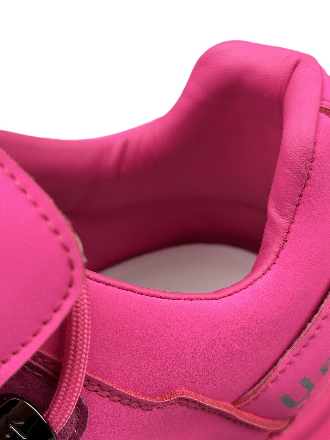 Focusing on vibrant pink detailing, these TALISHKO shoes highlight bold punk-inspired style.
