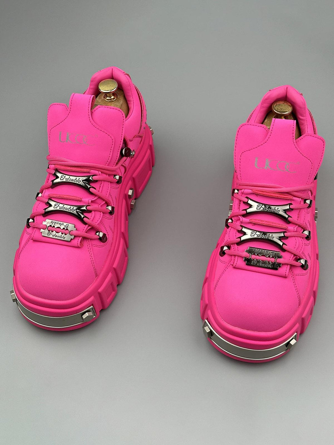 TALISHKO vibrant pink derby shoes with chunky design and rivet details, adding bold flair.