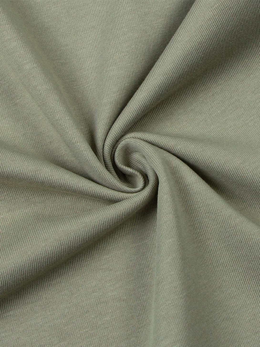 Zoomed-in texture of TALISHKO's quick-dry T-shirt, showcasing fine knit and elegant drape.