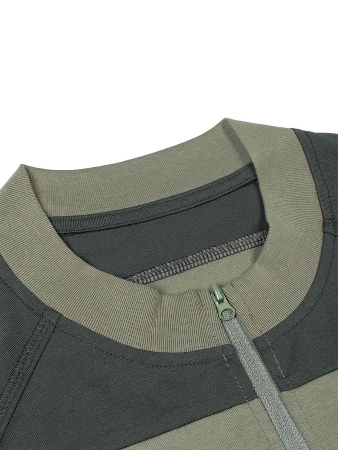 Detailed zipper and collar design of TALISHKO's quarter zip-up T-shirt in contrasting tones.