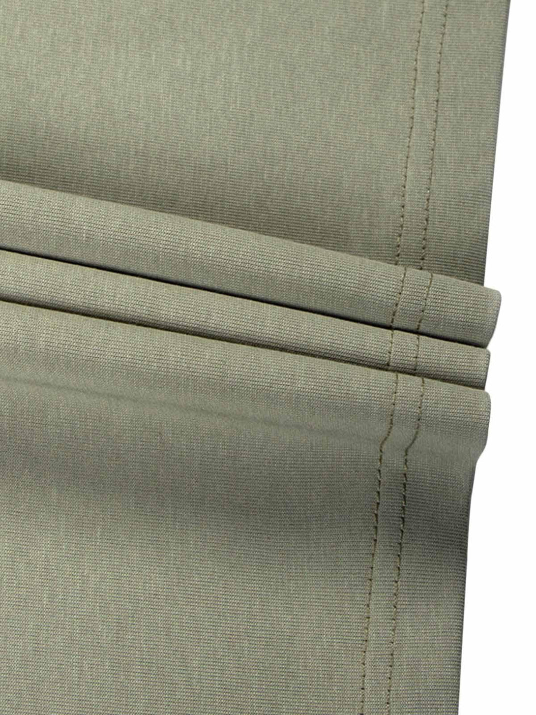 Detailed fabric and stitching on TALISHKO's quick-dry T-shirt in neutral tones.