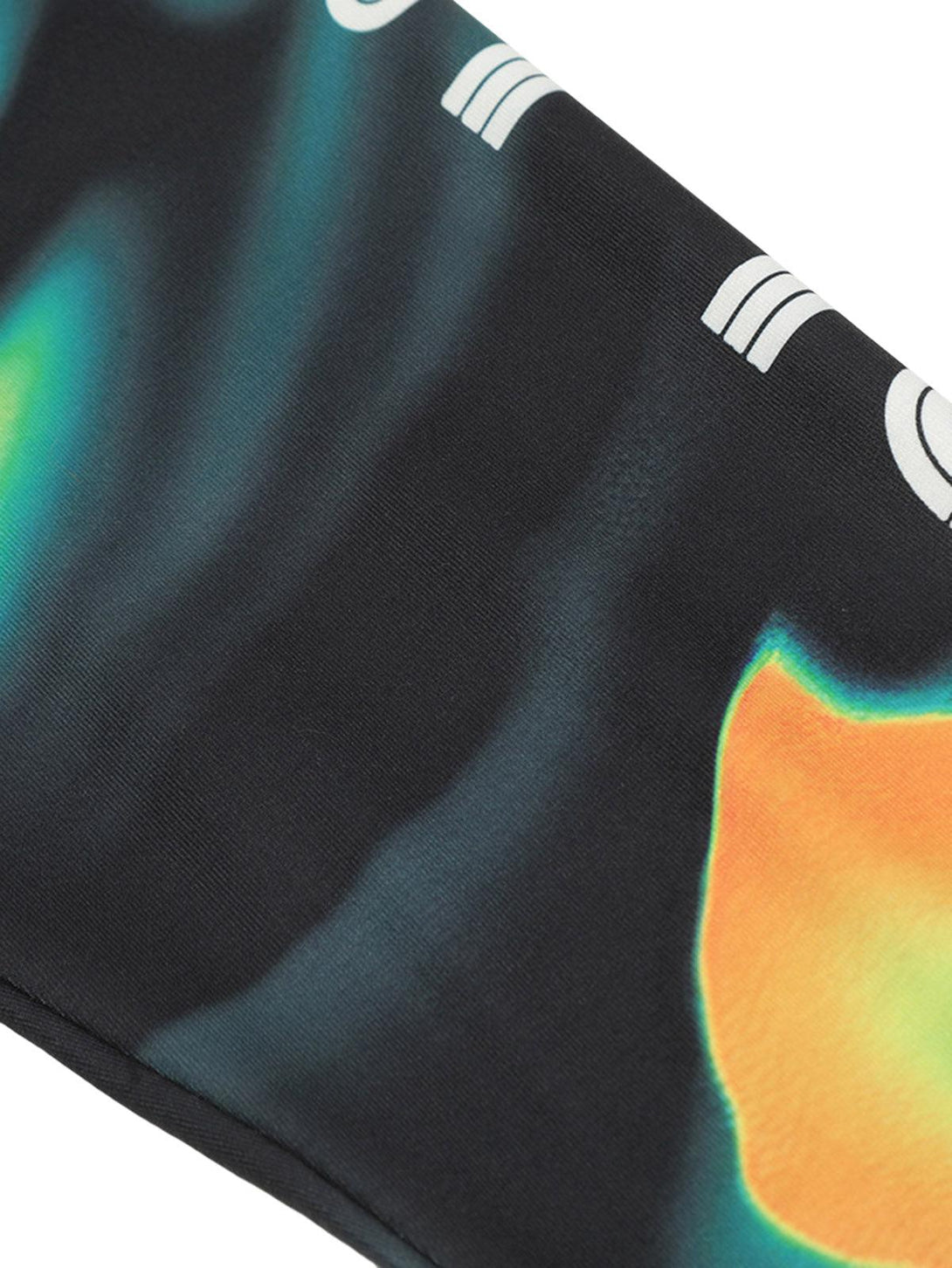 Zoomed-in texture of a TALISHKO quick-dry long sleeve T-shirt, showcasing vibrant patterns.
