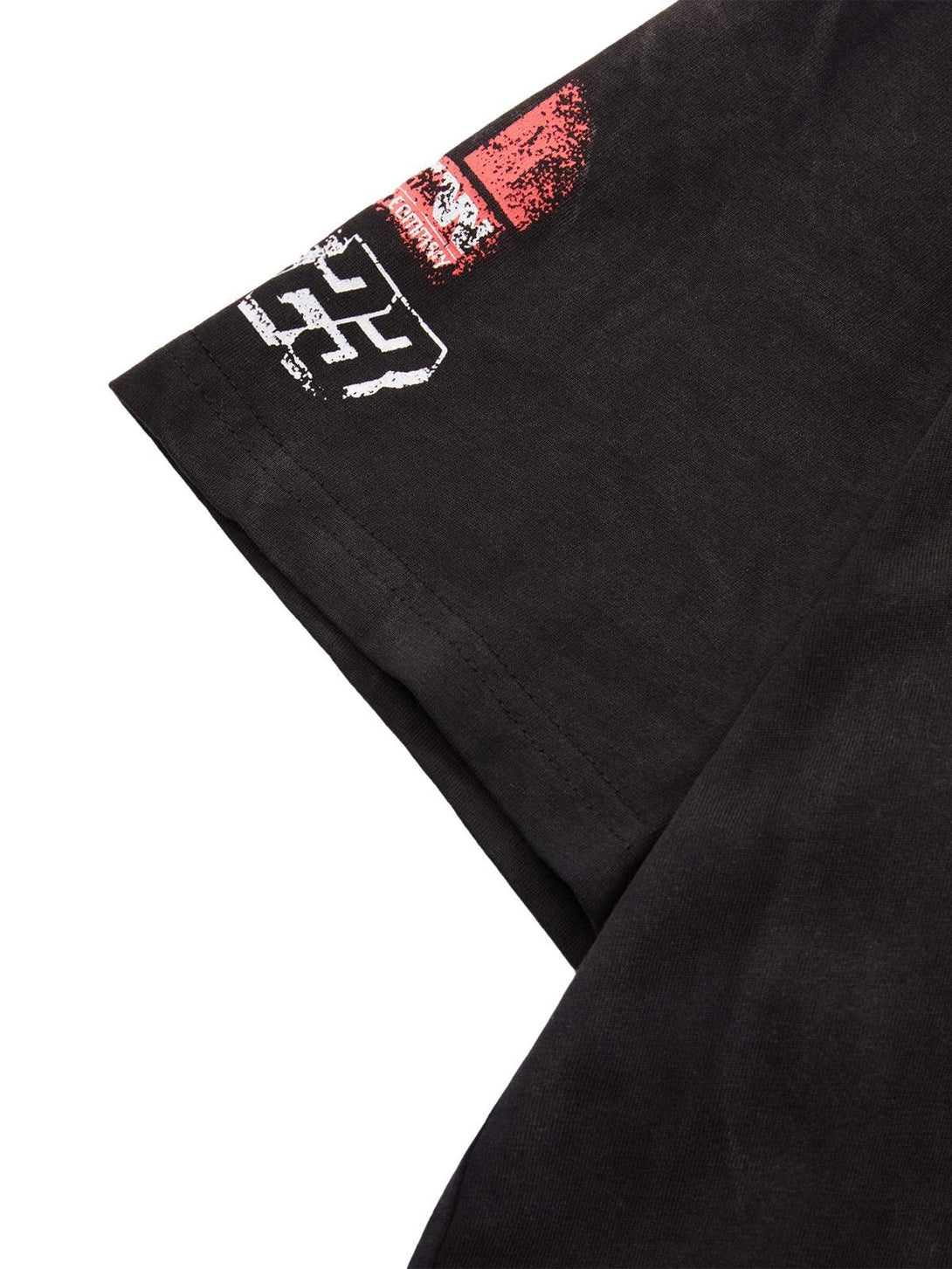 Detailed view of TALISHKO T-shirt sleeve featuring striking racing graphics and bold lettering.