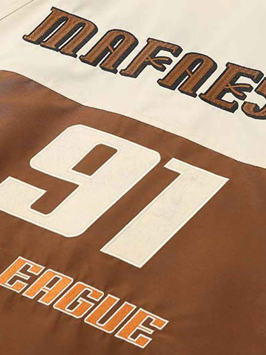 Intricate look at the back embroidery and patchwork on TALISHKO's racing jacket, highlighting number 91.