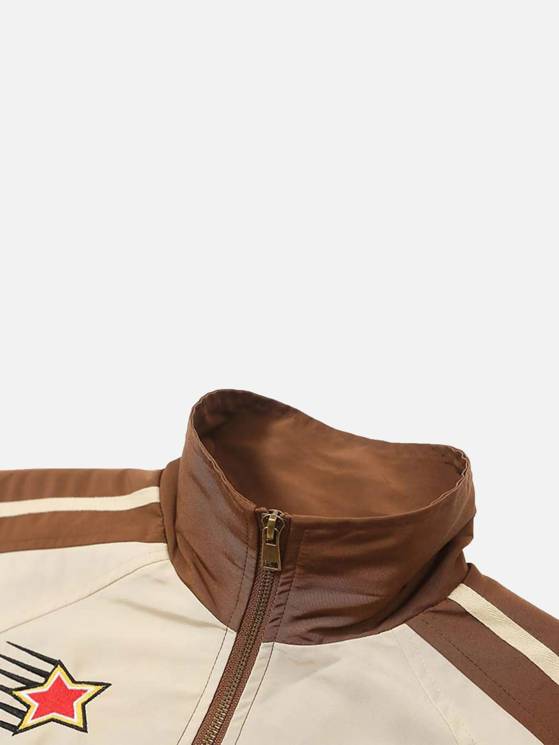 A detailed view of the collar and zip design on TALISHKO's racing jacket, featuring bold embroidery.