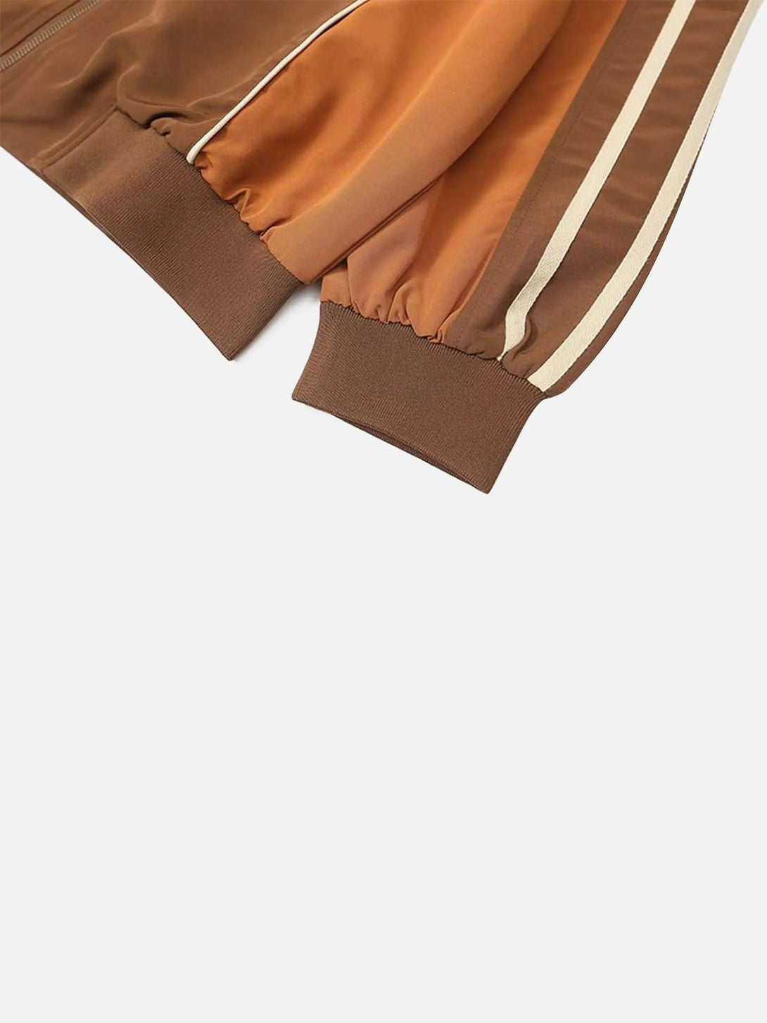 A tight crop highlighting the sleeve detail of TALISHKO's racing jacket with bold stripes and cuffs.