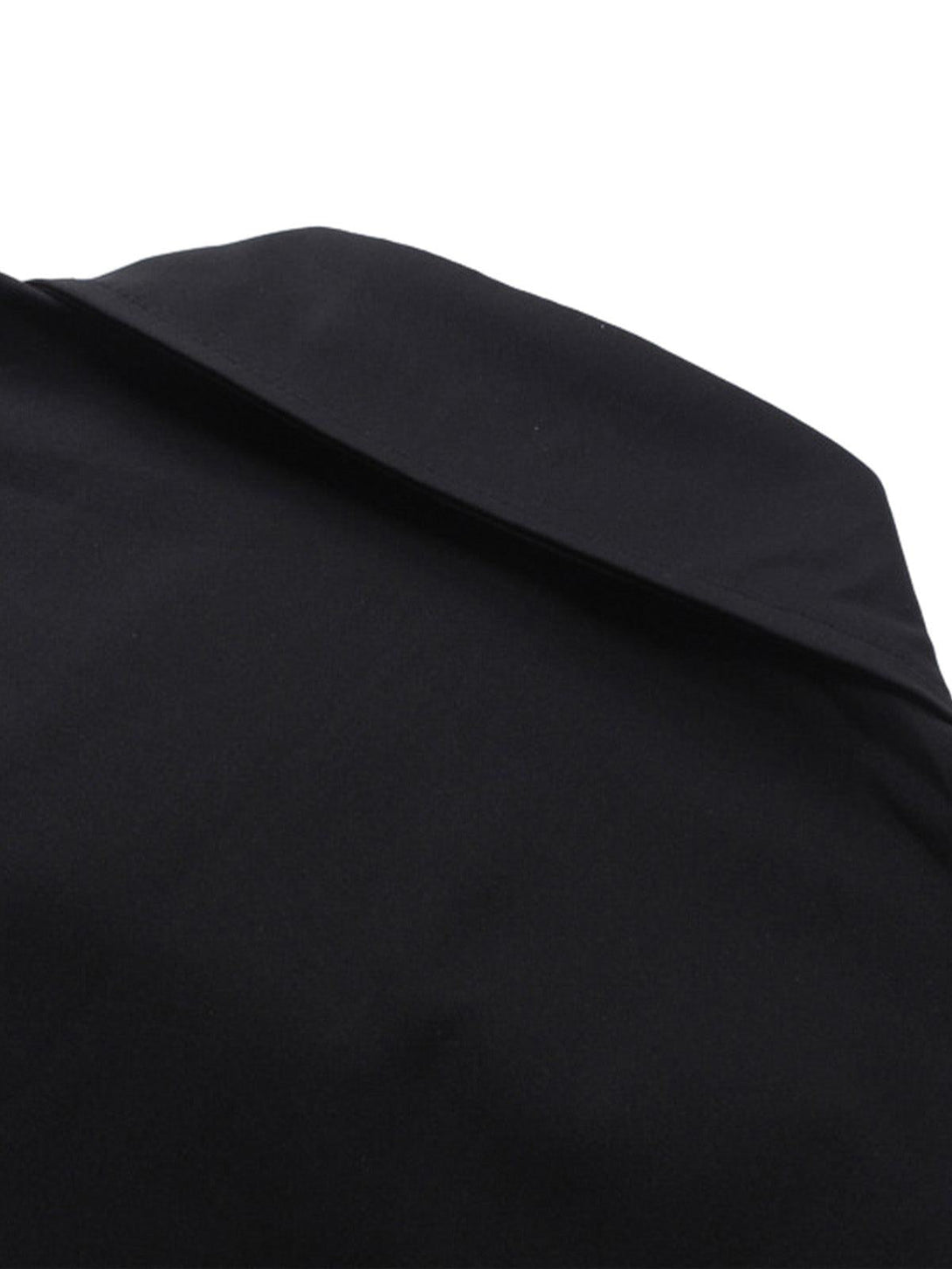 Focusing on the sleek collar detail of a black oversized racing-style shirt by TALISHKO.