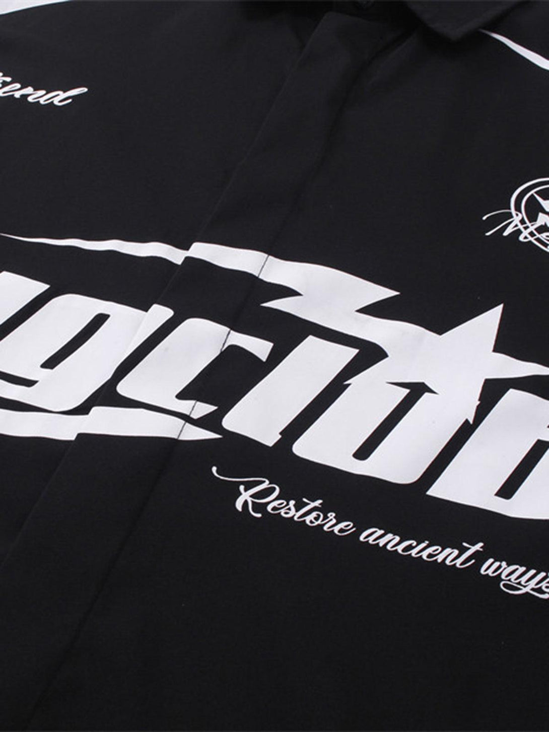 Intricate look at the bold white graphics on a black racing-style shirt by TALISHKO.