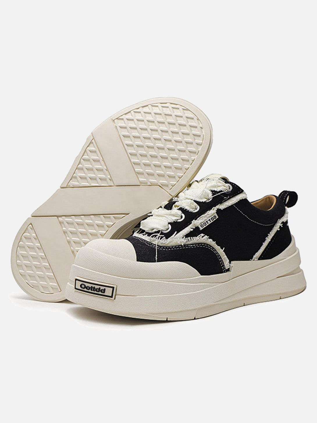 TALISHKO raggedy round toe sneakers with textured cream soles and distressed black fabric.