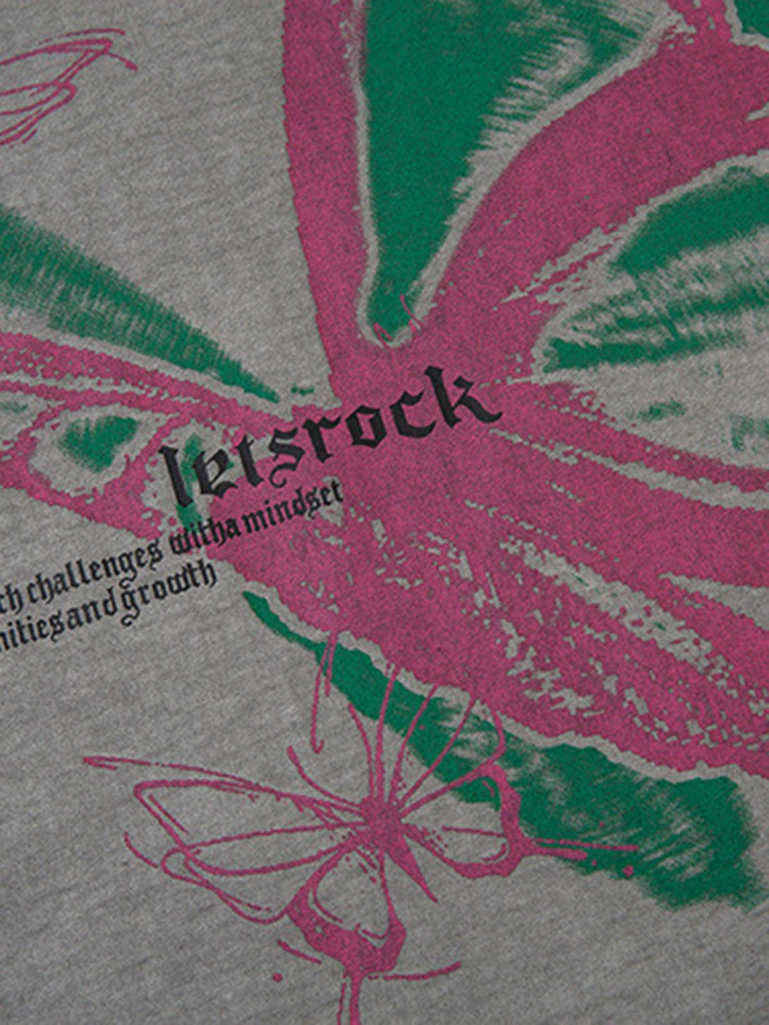 A detailed view of the butterfly print on a TALISHKO vest, highlighting vibrant colors and textures.