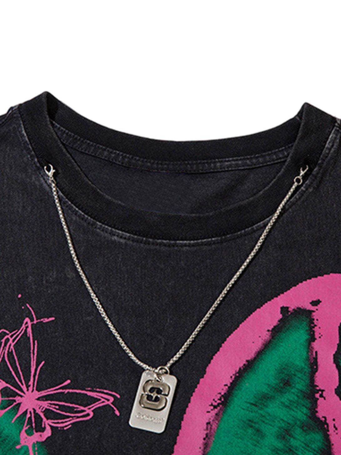 A close-up of the neckline on a TALISHKO vest with a butterfly print and raw edge detail.