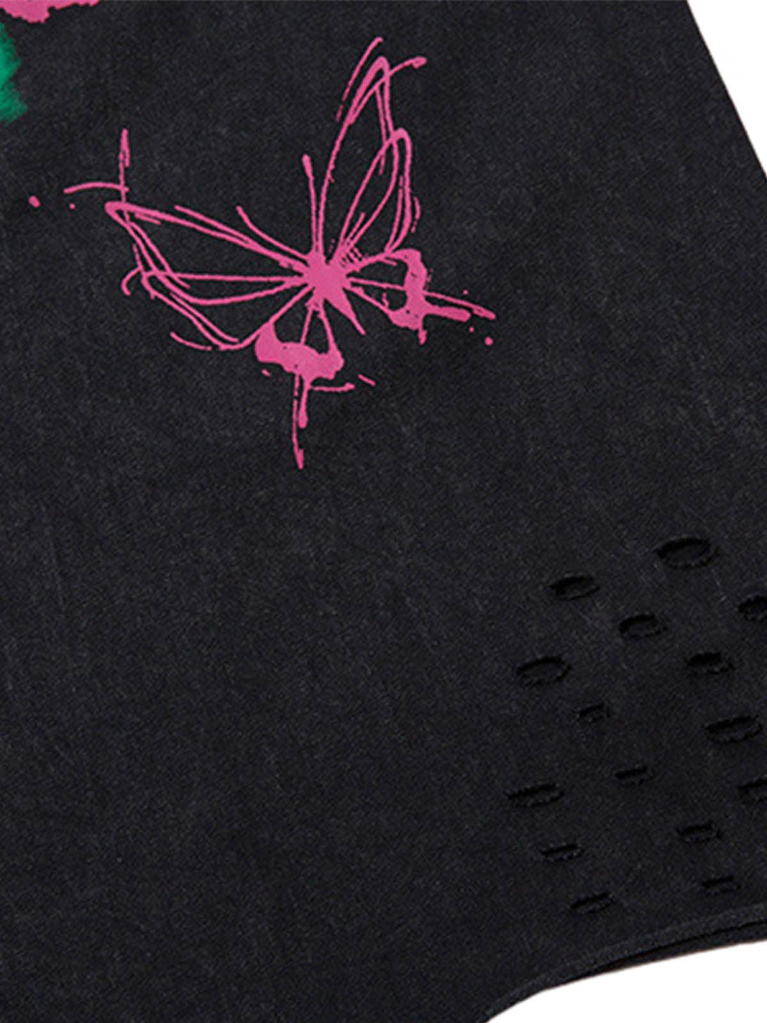 Zoomed-in view of a TALISHKO vest, showcasing a pink butterfly print and raw edge texture.