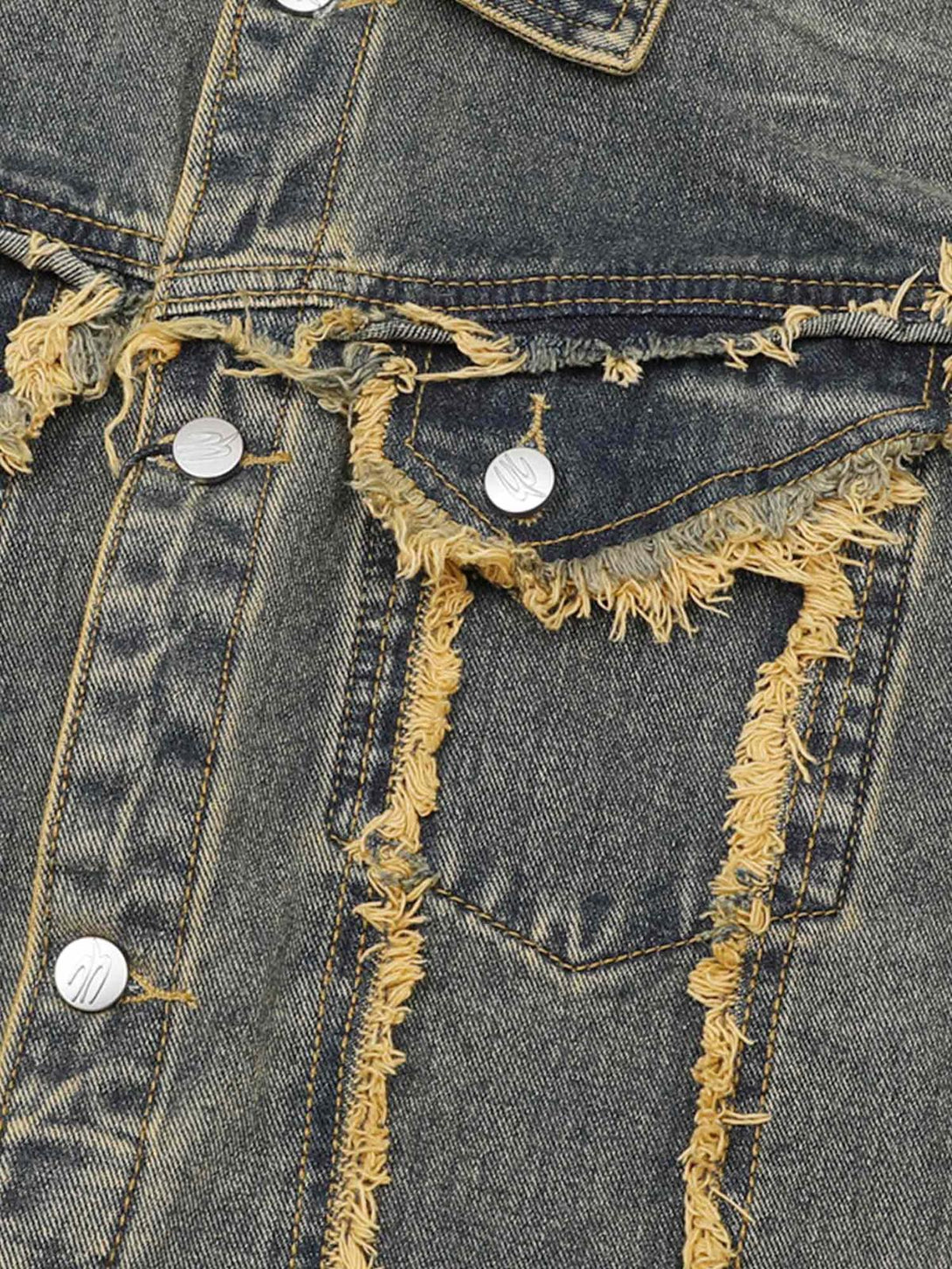 Intricate look at TALISHKO's raw edge distressed denim jacket with detailed stitching.