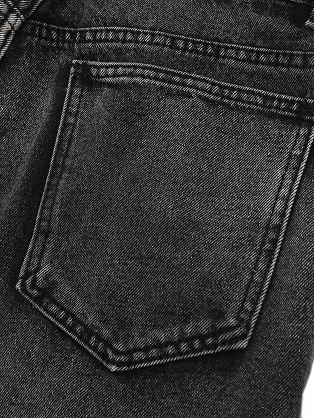 Focusing on the pocket detail of TALISHKO raw edge patch straight jeans, showcasing intricate stitching.