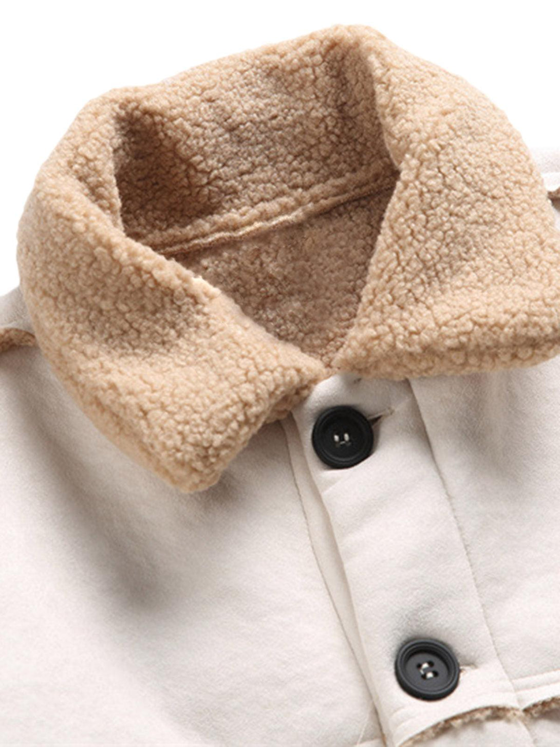 A detailed view of TALISHKO fleece jacket collar, highlighting its cozy texture and buttons.