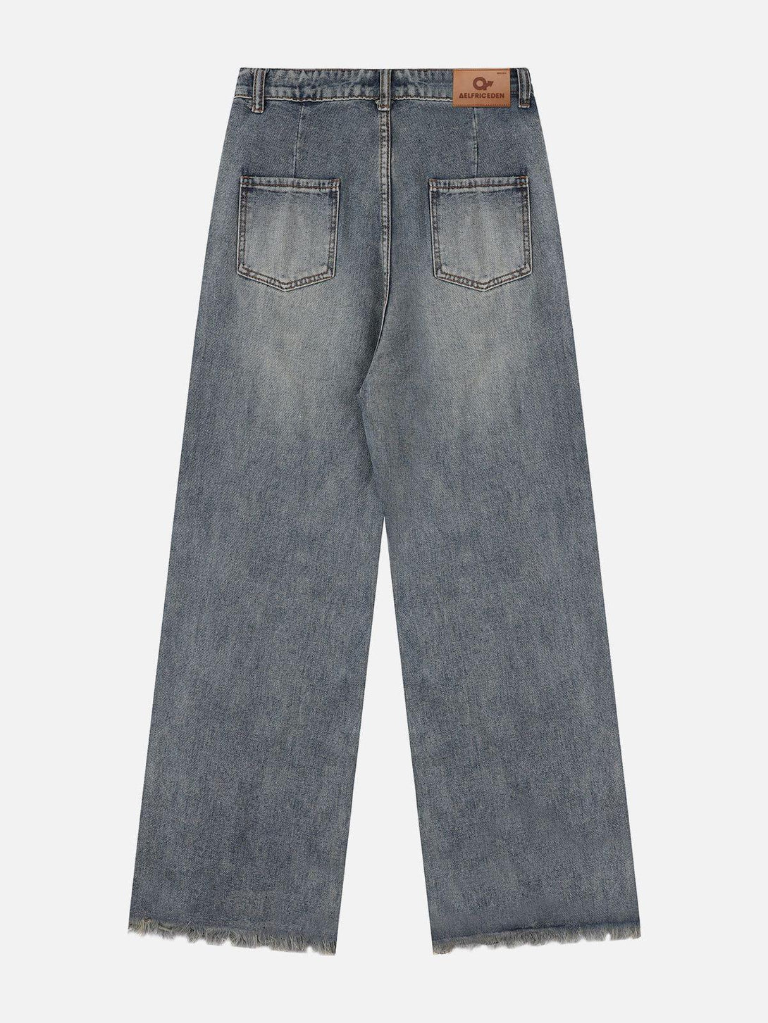 Back view of TALISHKO loose jeans highlighting faded wash and raw hem details.